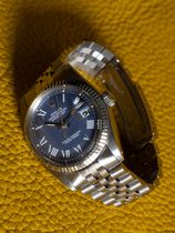 Rolex SOLD-Rolex Datejust 1601 from 1975 with a rare blue Buckley dial and a fluted gold bezel